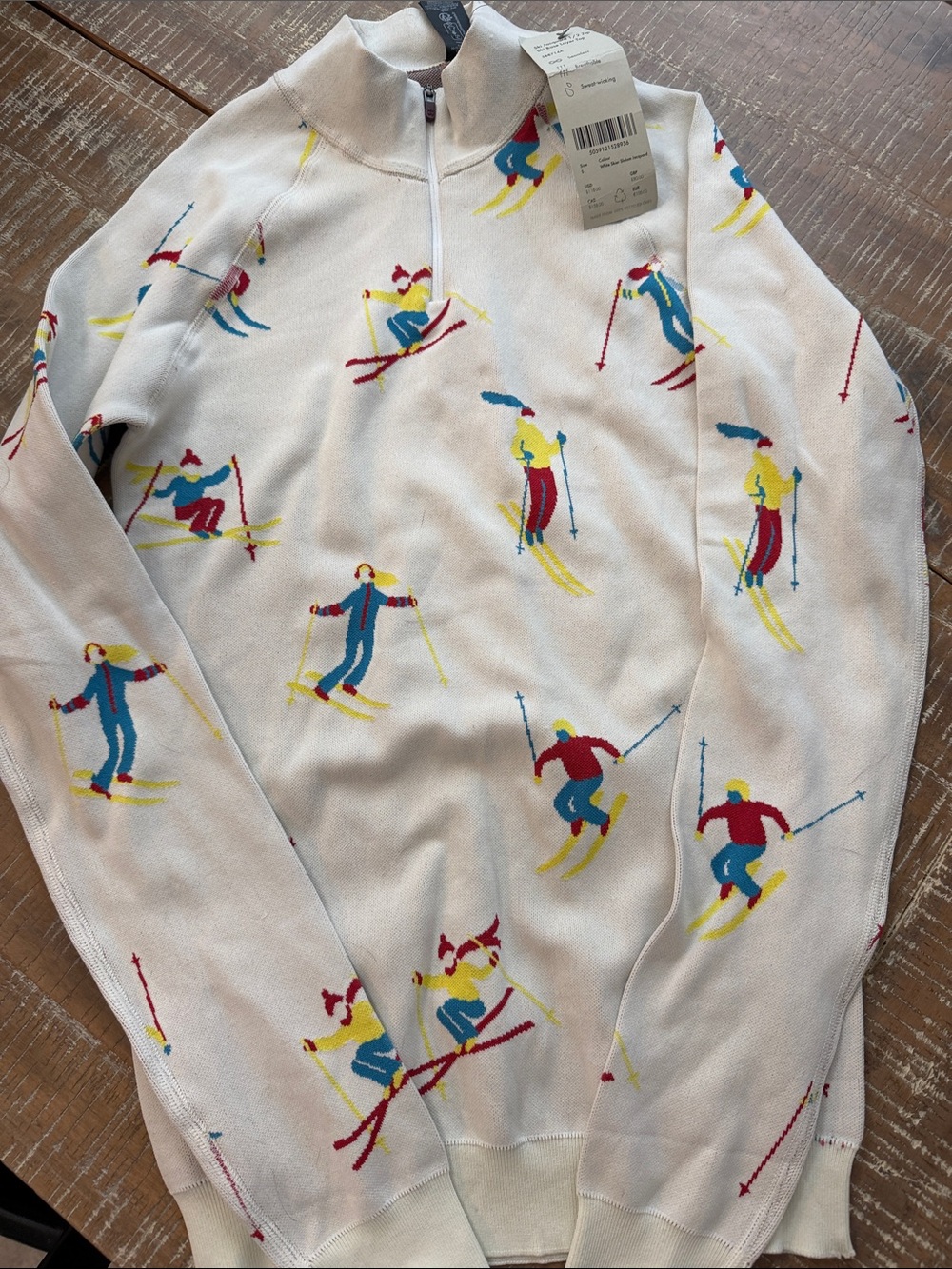 Sweaty Betty White Zip-Up Sweater with Red, Blue & Yellow Skier Motif